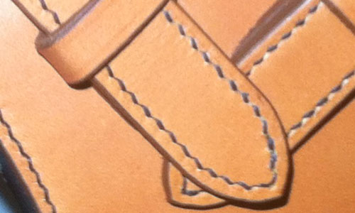 zoom sur couture point de sellier en fil de lin sur harnais en cuir
